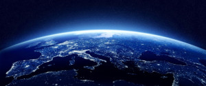 Earth at night as seen from space with blue, glowing atmosphere and space at the top. Perfect for illustrations. Elements of this image furnished by NASA